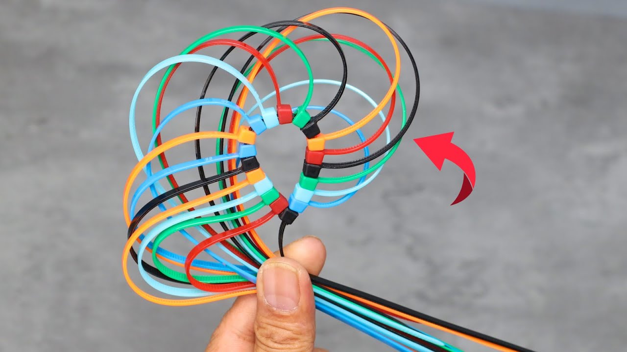 Colorful plastic cable ties arranged in a decorative pattern, demonstrating creative cable tie hacks and DIY uses